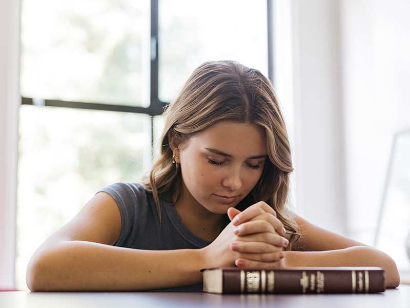 King's Schools Blog-young girl reading bible to learn more about God
